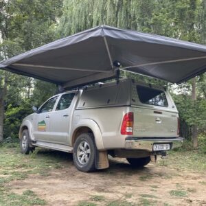 Image of Ostrich Wing Junior Awning setup on 4x4 Vehicle
